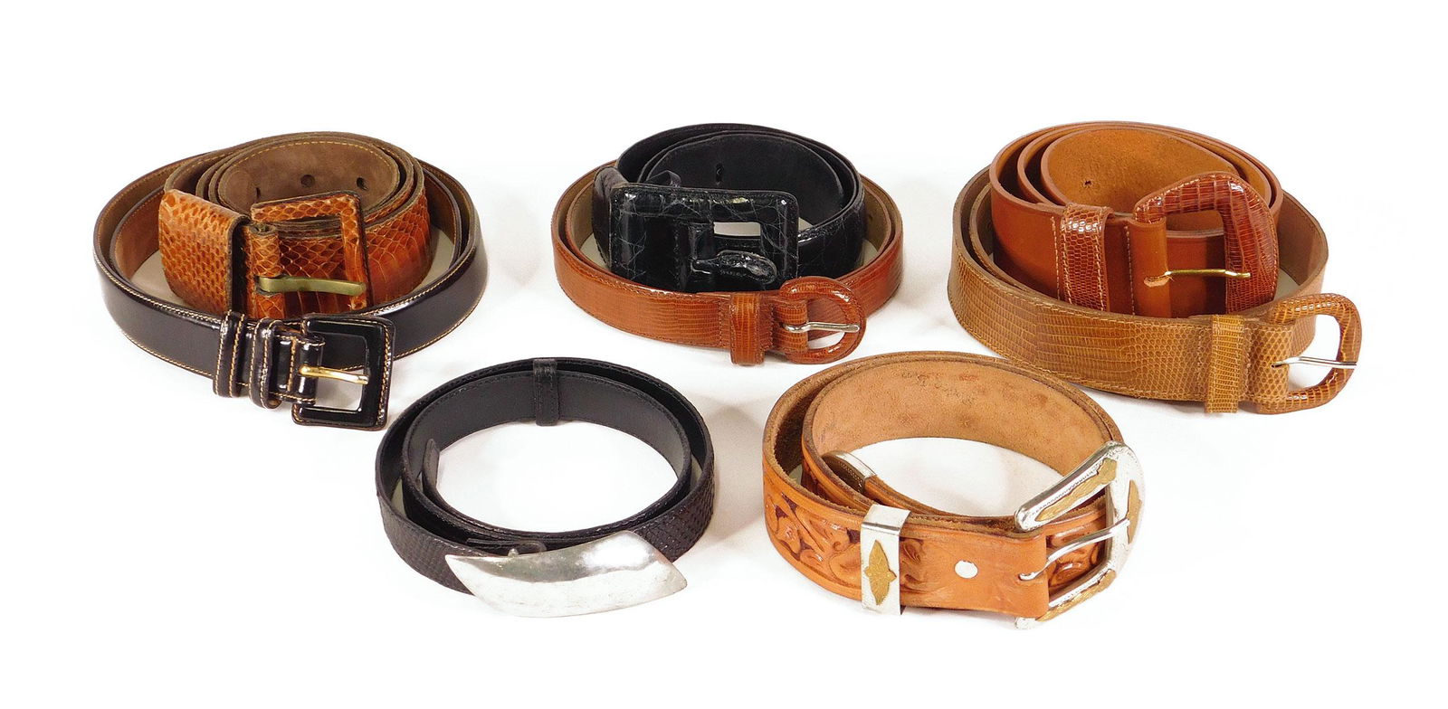 Calvin Klein, Paul Stuart: Eight Women’s Belts: Eight women's belts, comprised of: a Paul Stuart black leather belt, made in Italy, size medium; a Calvin Klein tan lizard belt, origin unmarked, size small; a Calvin Klein gloss brown lizard grain le