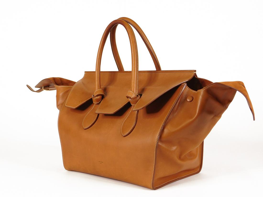 Céline Tie Small Tote in Tan Calfskin: A Céline small Tie tote in tan calfskin. 2014, Ref. 173823TKA.04LU. Finished calfskin exterior, sueded calfskin interior, with interior pocket flap comprised of two open pockets and one zippered pock