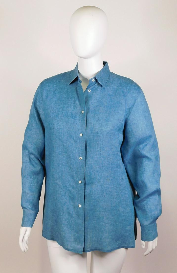 Loro Piana: Three Shirts: Three Loro Piana women’s shirts, comprised of: a) a blue chambray shirt, size 48, 100% flax; b) a khaki safari-style shirt, size 50, 75% cotton/25% silk; a green shirt/light jacket with brass sleeve