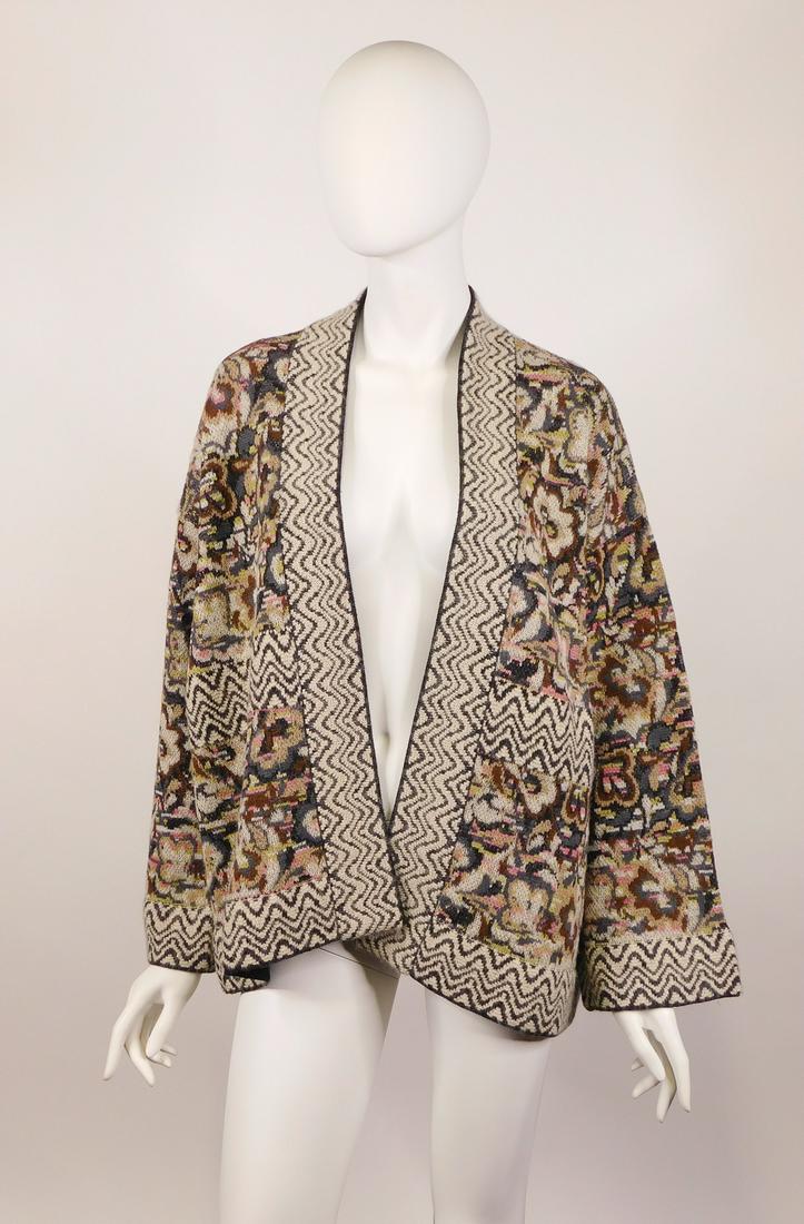 Moncler, Missoni: Two Wool Cardigans: A Moncler black 100% virgin wool cardigan with a split vented back panel lined with black polyester fabric and trimmed with the same at the bottom hem. Size XL, made in Romania. Along with a polychrom