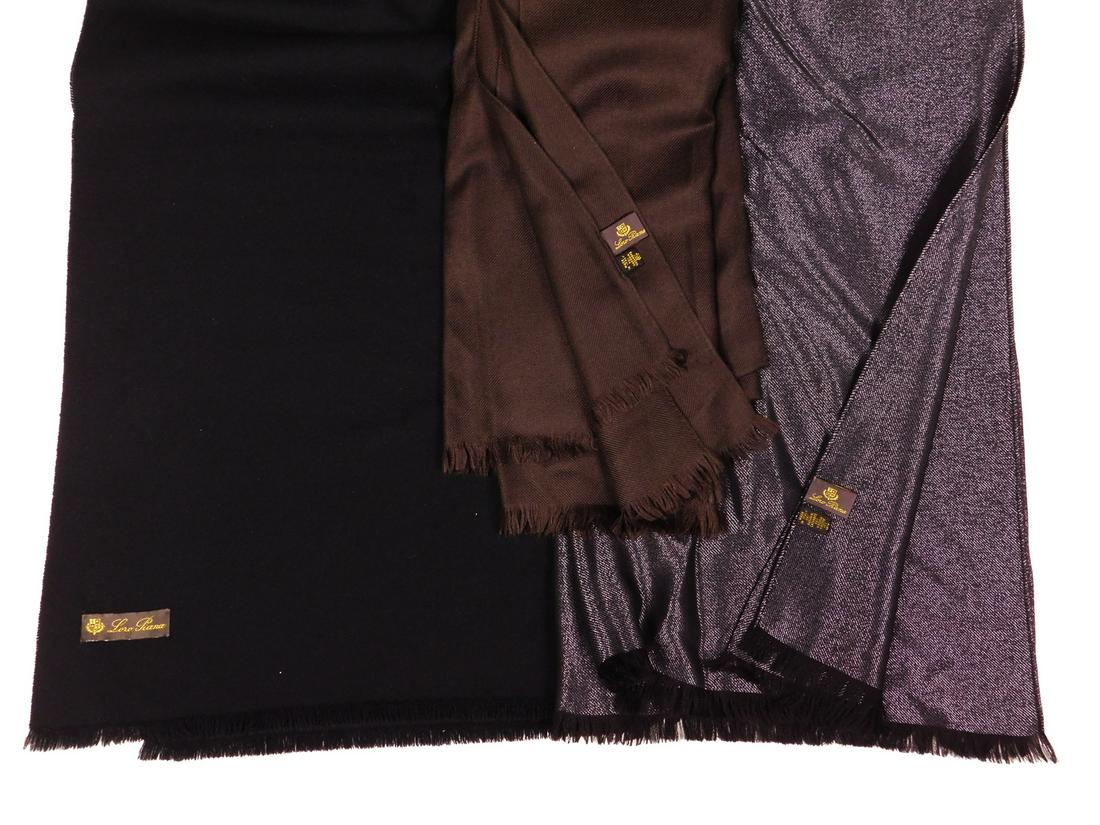 Loro Piana: Three Scarves: Three Loro Piana fringed scarves, all approximately 28" x 80". Comprised of: a) one dark brown scarf, 70% cashmere/30% silk; b) one black scarf, apparently of the same composition or similar; and c) o