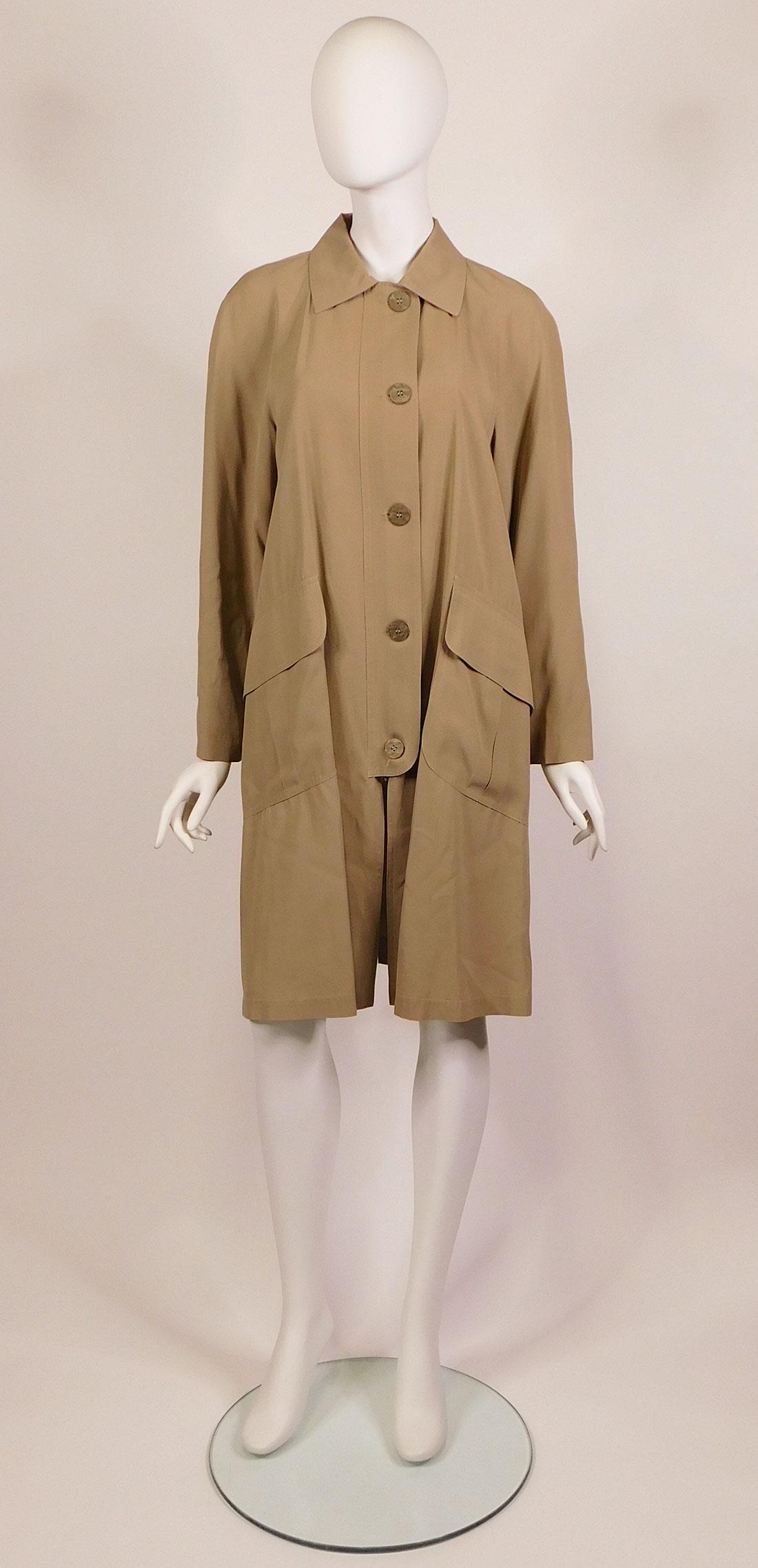 Barbera, Calvin Klein: Women’s Trench Coats: A collection of women's trench coats, various designers. Comprised of: a) a tan Luciano Barbera unlined trench coat, size 44, 65% cotton/35% silk, made in Italy; b) a Sonia Rykiel black trench coat/lo