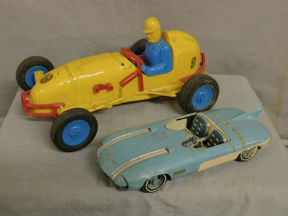 Midget Indy Race Car & A Model Car: Midget Indy Race Car and A Model Car, key wind yellow plastic with red fittings and driver, possibly Argentina 1970s, 9" l; plus Pontiac Club de Mer assembled plastic kit car in blue and white, 6 3/4"