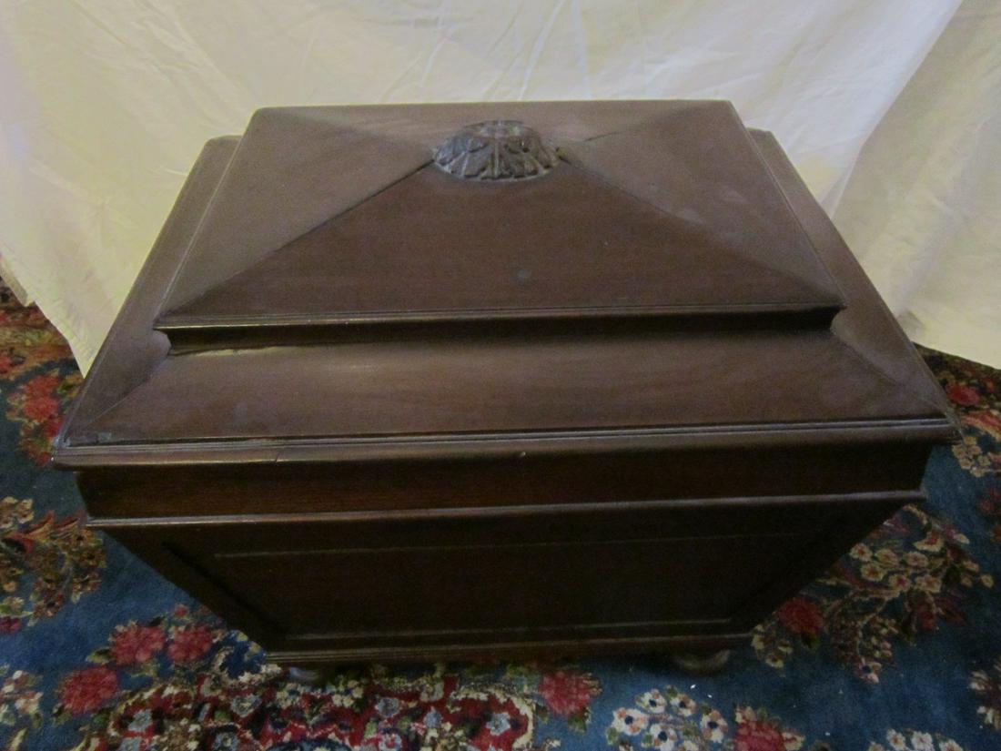 Antique Wine Cooler / Cellarette: Antique Wine Cooler / Cellarette, mahogany, lift lid, casket form, on bun feet, 19th c. Condition; areas of open seams scratches and wear