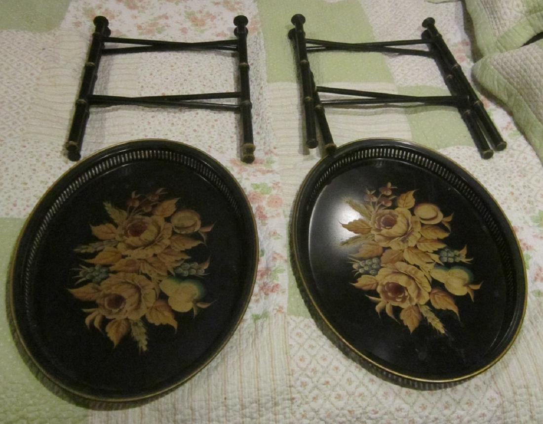 Pair Toll Ware Tray Tables: Pair Toll Ware Tray Tables, floral painted, oval galleried toll ware trays on folding black painted bamboo style bases, 21 1/4" x 16 3/8" tray, Condition; good, used