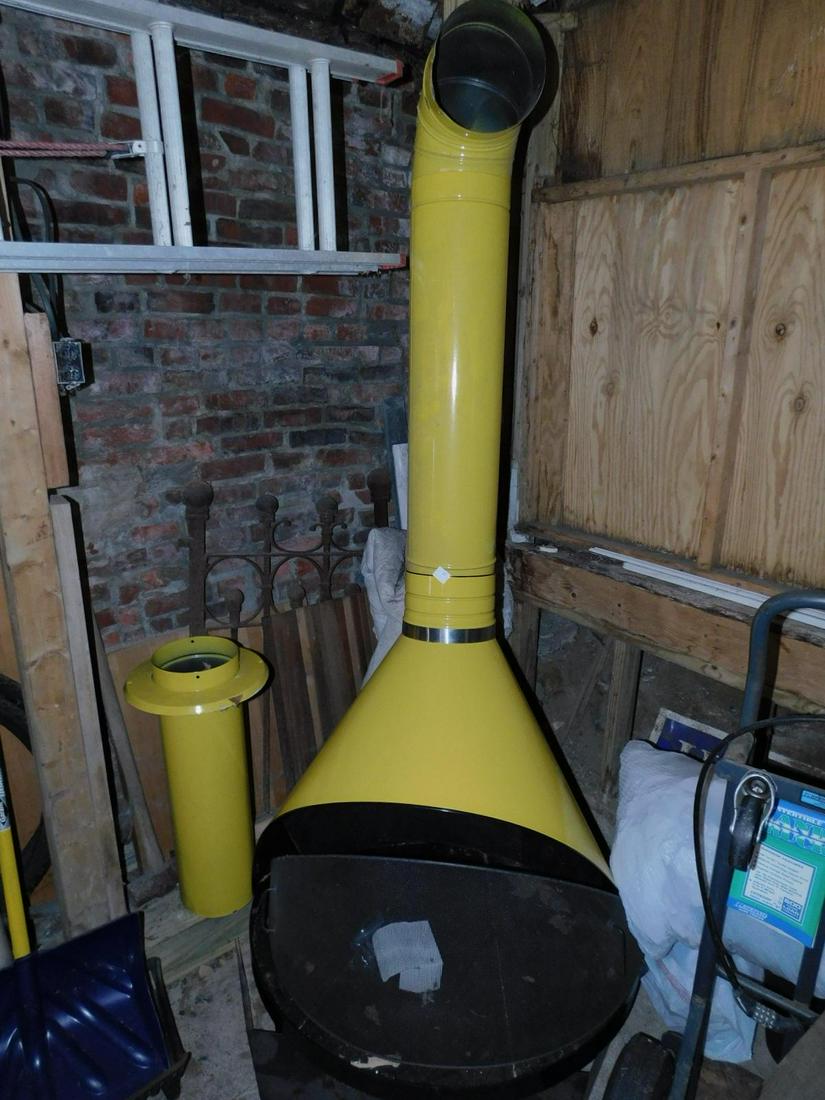 Mid Century Modern Free Standing Fire Place: Mid Century Modern Free Standing Fire Place, yellow enameled sheet metal with chimney pieces and instruction pamphlet, wood burning, 88" h. Condition; partially assembled, very fine, no scratches on e