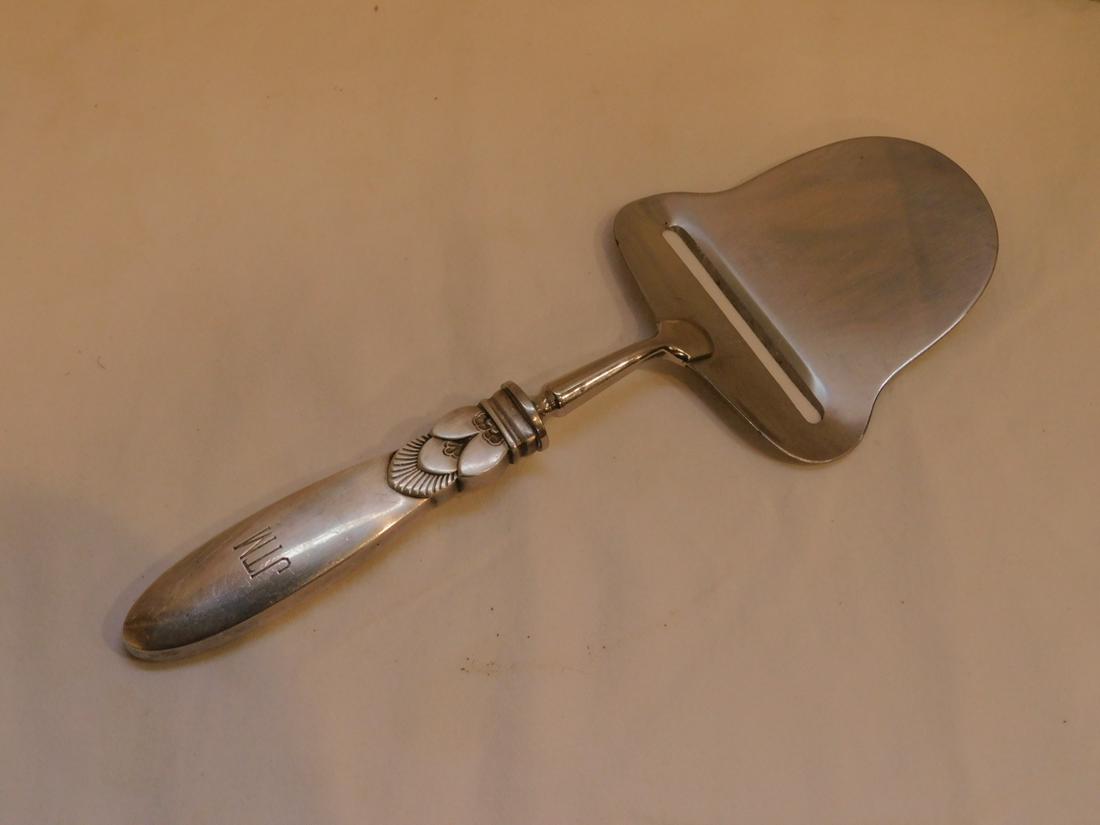 George Jensen Cheese Server: George Jensen Cheese Server, Cactus pattern, sterling (marked) hollow handle, 8" l. Condition; monogramed, surface wear to handle