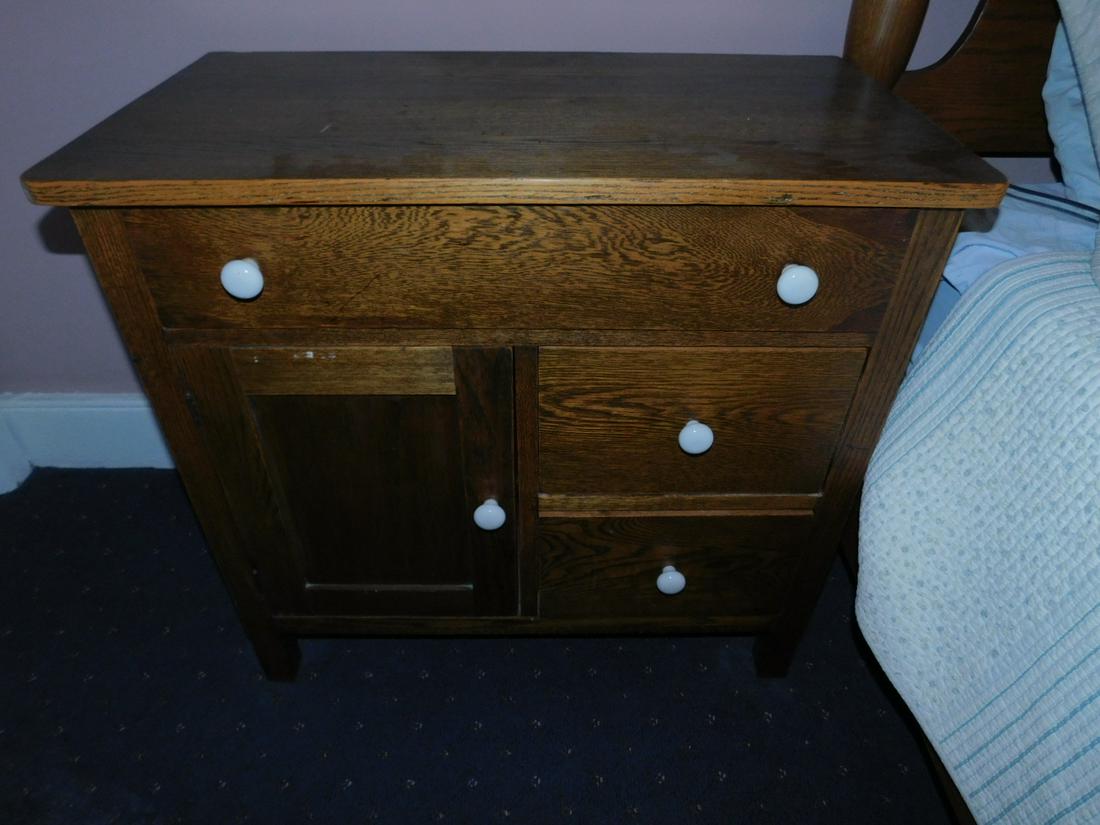 Pair Golden Oak Wash Stands: Pair Golden Oak Wash Stands, three drawer and single door with porcelain pulls, 17 3/4" x 32" x 29 1/2", early 20th c. Condition; very good