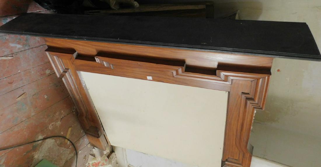 Classical Mantle: Classical Mantle, cherry, ebonized wood top, deep moldings, with a cast iron scroll work grate, 64" x 52 1/2" x 9 1/4" Condition; very good