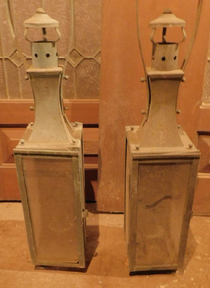 Pair Brass Lanterns: Pair Brass Lanterns wall mount, three glass panel, crest handles, approx. 15" h. Condition; tarnished, need cleaning