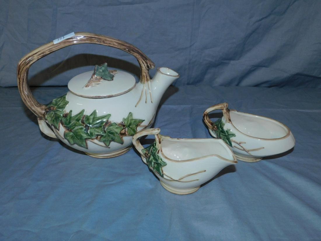 McCoy 3 Piece Tea set: McCoy 3 Piece Tea set, Ivy pattern, tea pot, creamer and sugar. Condition; crazing glaze on teapot