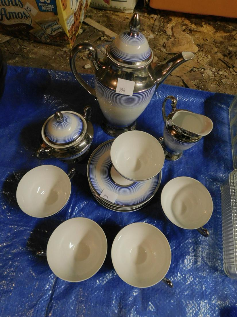 13 Piece Coffee set: 13 Piece Coffee set, porcelain, Giesche Malewany, silver overlay with blue stripes, coffee pot, creamer and sugar, five cups and saucers. Condition; very good