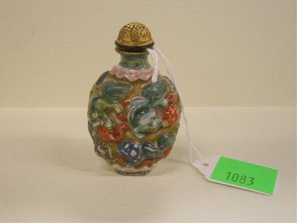Snuff Bottle With Foo Dogs & Ball Of String: Snuff Bottle, enameled porcelain high relief With Foo Dogs & Ball Of String, engraved Dore brass cap. height 2 7/8", 19th c.