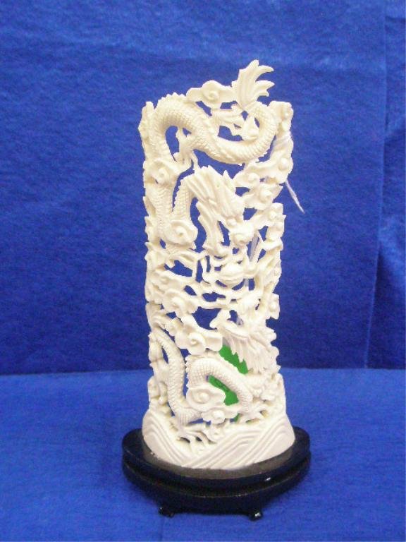 Two Oriental Ivory Reticulated Carvings: Two Oriental Reticulated Carvings, 5 5/8" Ivory dragons on wood stand & a 9 1/4" Buddhist bone carving of goddess & mask; 20th c. [24&25]. No International Shipping