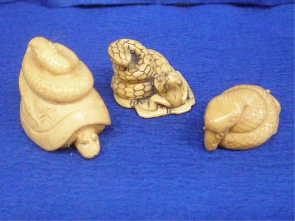 Three Ivory Snake Netsuke's: Three Ivory Snake Netsuke's, H 35mm snake upon a turtle, H 25mm upon a lily pad with frog, H 20mm eating a rat. all signed; 20th c. [54]. No International Shipping