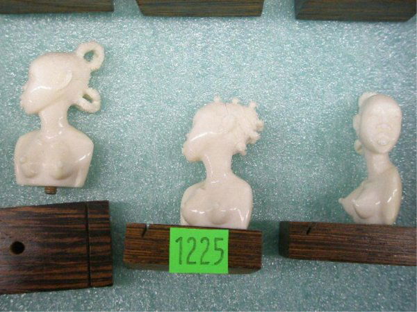 Set of 12 African Ivory Busts: Set of 12 African ivory busts of topless women on tiger wood bases, H approx. 2 3/8", 20th C. No International Shipping