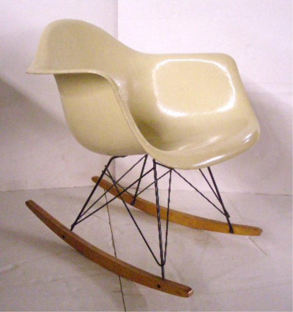 Charles Eames/Herman Miller Rocker: Eames for Herman Miller rocker, cream molded fiberglass seat, cat's cradle base and birch runners. Embossed marks underside. American, mid-20th C.