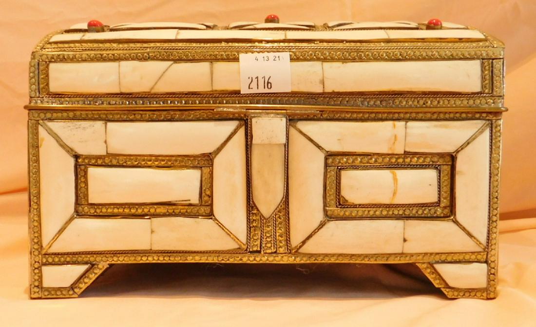 Bone and Metal Persian Jewel Casket: Bone and Metal Persian Jewel Casket, hinged dome lid with three red cabochon stone jewels, maroon velour interior, 7 3/$' x 12" x 7". Condition; some cracks in bone pieces