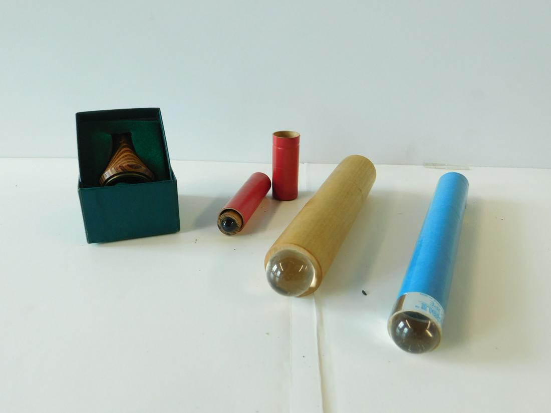 4 Assorted Marble Kaleidoscopes: Four Assorted Marble Kaleidoscopes, three marble and one 2" Van Cort "Dragonfly" with original box. 8" blue cardboard tube, 1" wooden tube, 2" wooden tube in red cardboard tube, plus three marbles.[5]