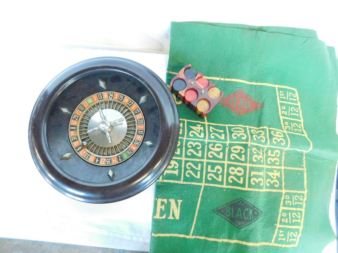 Vintage Bakelite Roulette Wheel & Accessories: Vintage Bakelite Roulette Wheel and Accessories, includes: 12"d brown bakelite roulette wheel with nickle plated metal fittings and ball by Scott Games, NY; a green felt playing surface and a bakelite