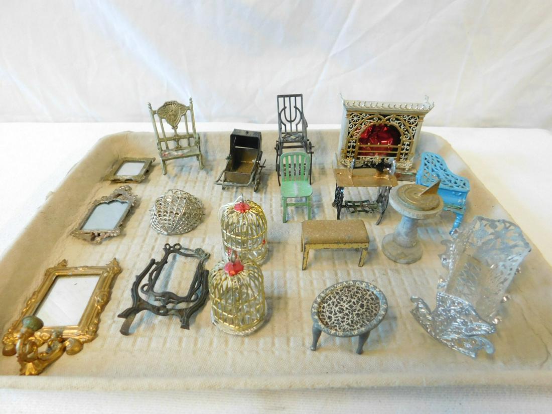 Antique Metal Doll House Furniture: Antique Metal Doll House Furniture includes: fireplace, folding high chair, piano, cradle, treadle sewing machine, bird cages, mirrors, etc., 19th / 20th C. CONDITION: Generally good, used cond., Fren