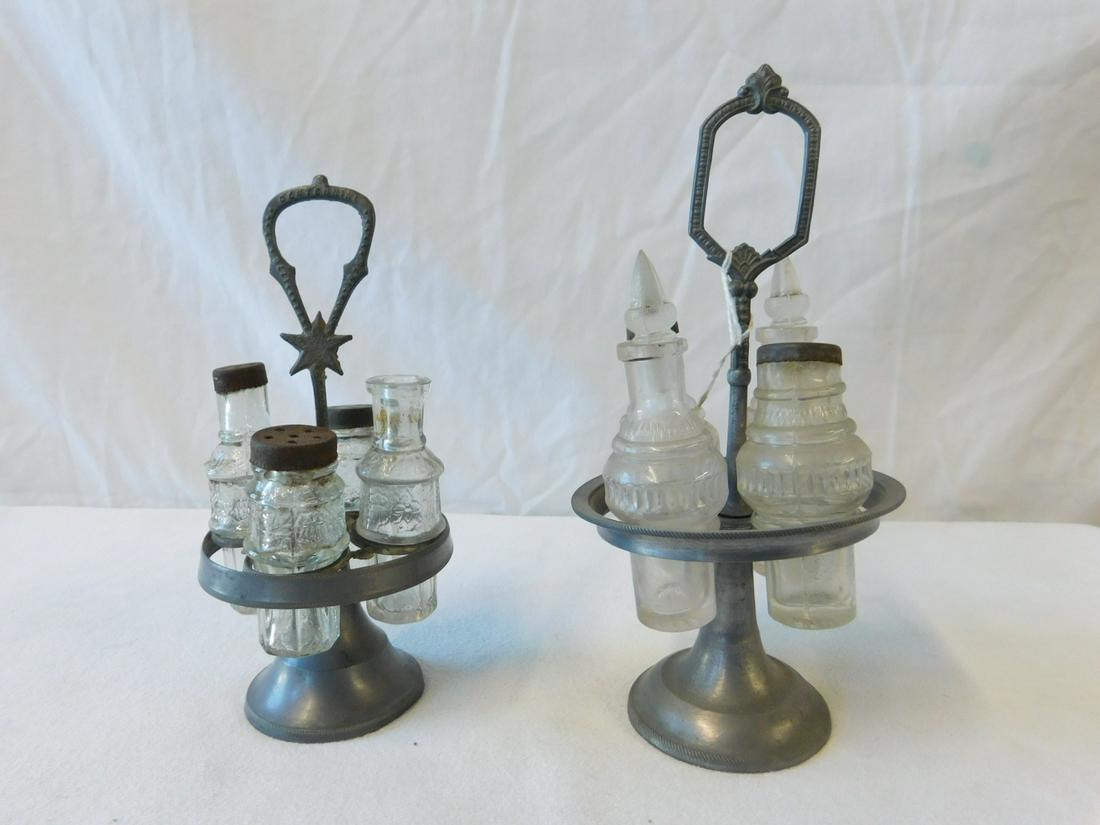 2 Child's Victorian Caster Sets: 2 Child's Victorian Caster Sets, pewter rotating stands, each with four pressed glass containers, late 19th C, height 7 3/4" and 6 1/4". CONDITION: 7 3/4" with crack in pewter crest handle, 6 1/4" wit