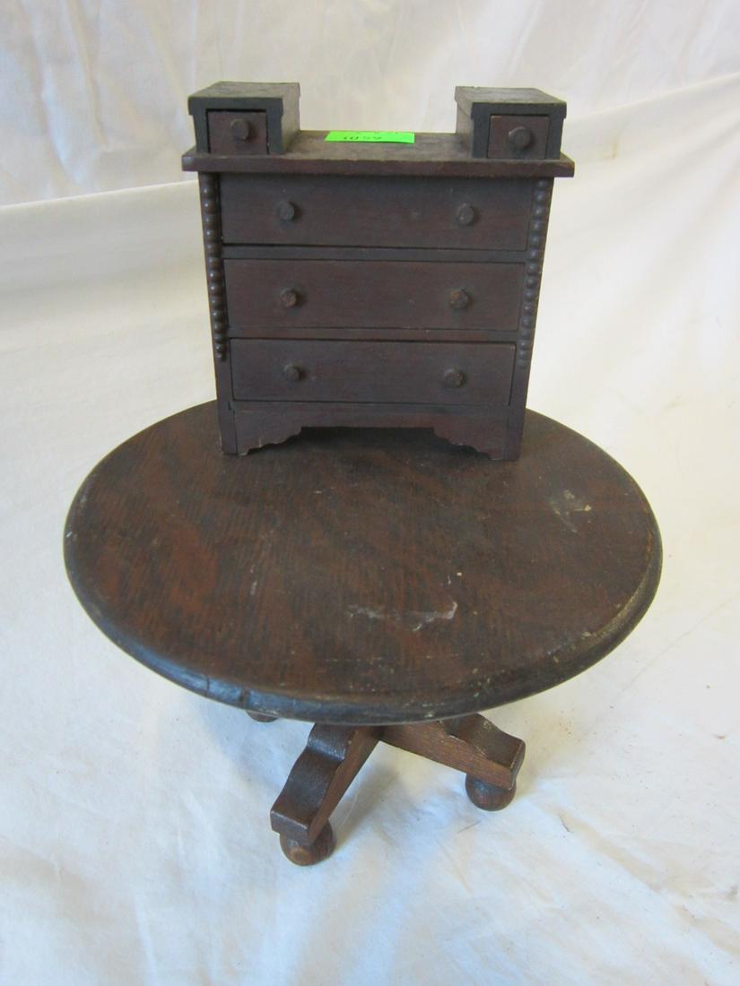 Vintage Wood Doll House Furniture: Vintage Wood Doll House Furniture includes: walnut finish Victorian dresser with two glove boxes over three long drawers, 4 3/4" x 2 1/2" x 4 3/4", and an oak round top pedestal table, 8" x 5 5/8", ea