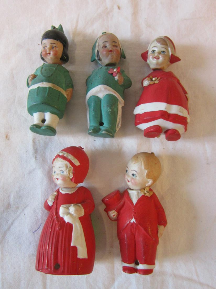 5 German Bisque Nodders: Five German Bisque Nodders, includes: pair of green dressed Indian boy and girl and three red formally dressed figures, two girls and boy with top hat, approx. 3", early 20th C. CONDITION: Very good.