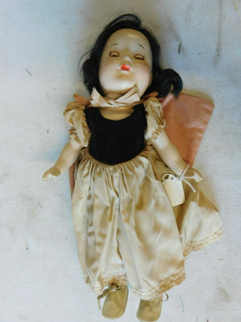 Mme Alexander Snow White Doll: Snow White Doll Madame Alexander, composition head and body with brown sleep eyes, original outfit, undergarments, and shoes, 13". CONDITION: Line cracks on face, some crazing on body, slight soiling 