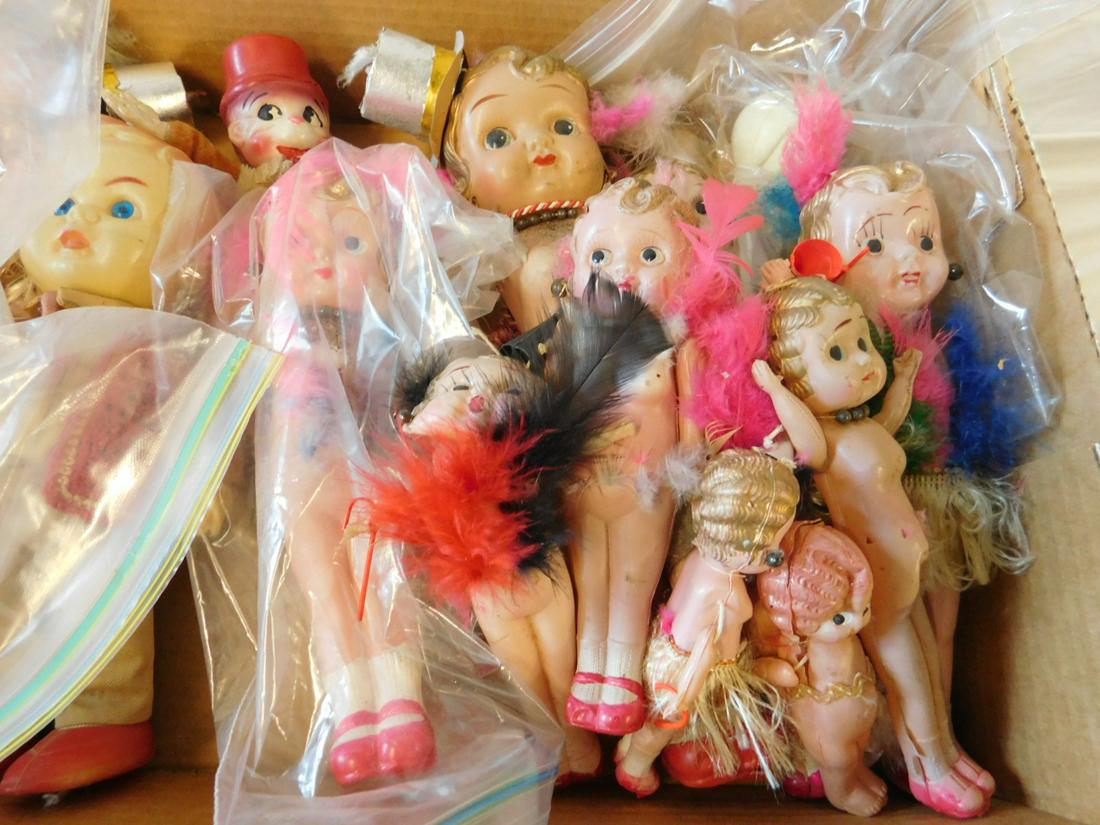 15 Kewpie & Other Dolls: 15 Kewpie and Other Dolls,celluloid, twelve Kewpies from 4 1/2" to 11 1/2" plus dressed 8 1/2" boy doll, a monkey and clown doll, early to mid 20th C. CONDITION: Most with only remnants of clothing, s