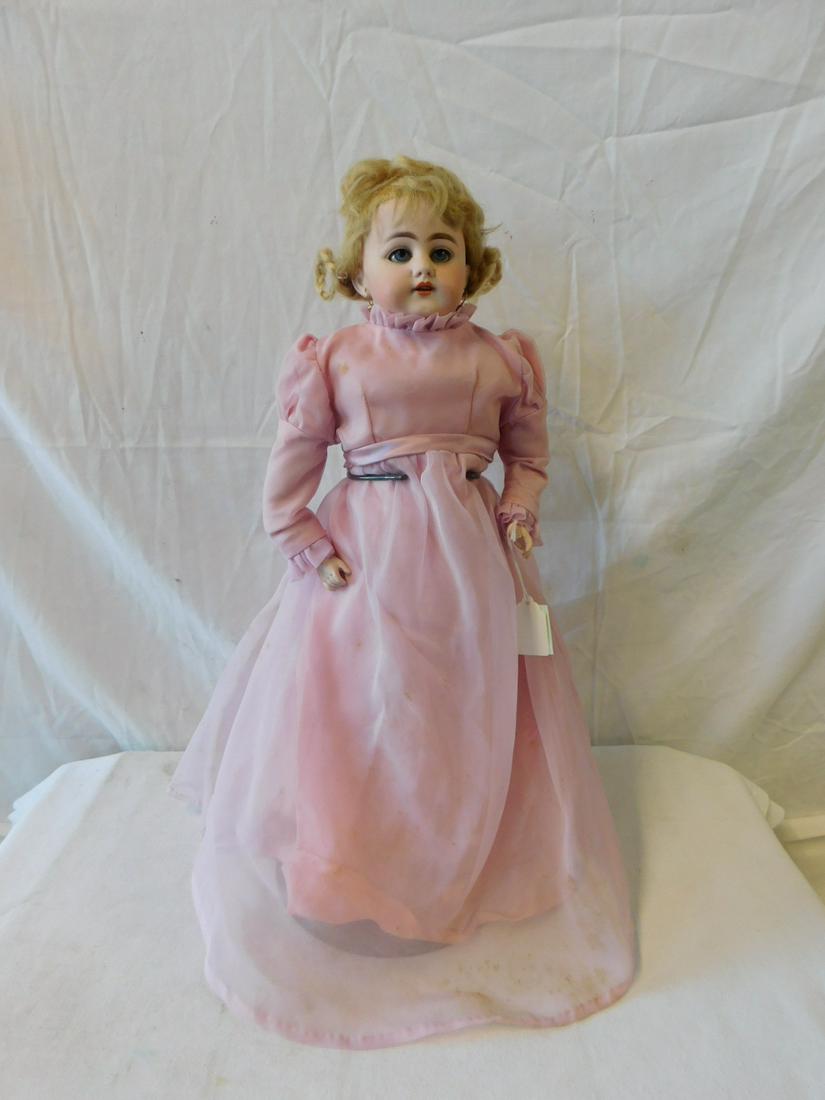 Antique Bisque Doll (possibly French): Antique Bisque Doll (possibly French), head and shoulders, blue sleep eyes, open mouth with teeth, pierced ears, blond wig, kid body with bisque hands, replaced pink gown with vintage undergarments, 1