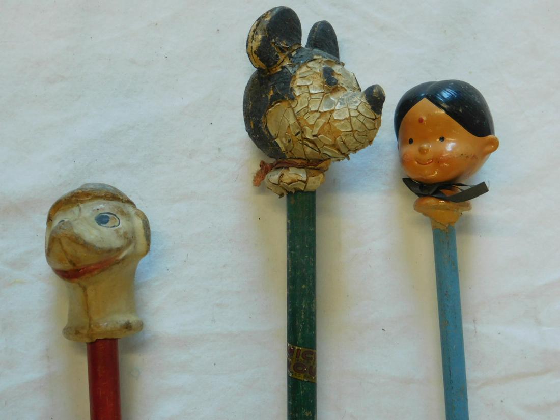 3 Large Head Handled Carnival Canes: Three Large Head Handled Carnival Canes including: child's cane with composition dog head, wearing hat, 2 1/2" with red painted wood shaft, 21 3/4" overall length, Mickey Mouse composition head, pie-e