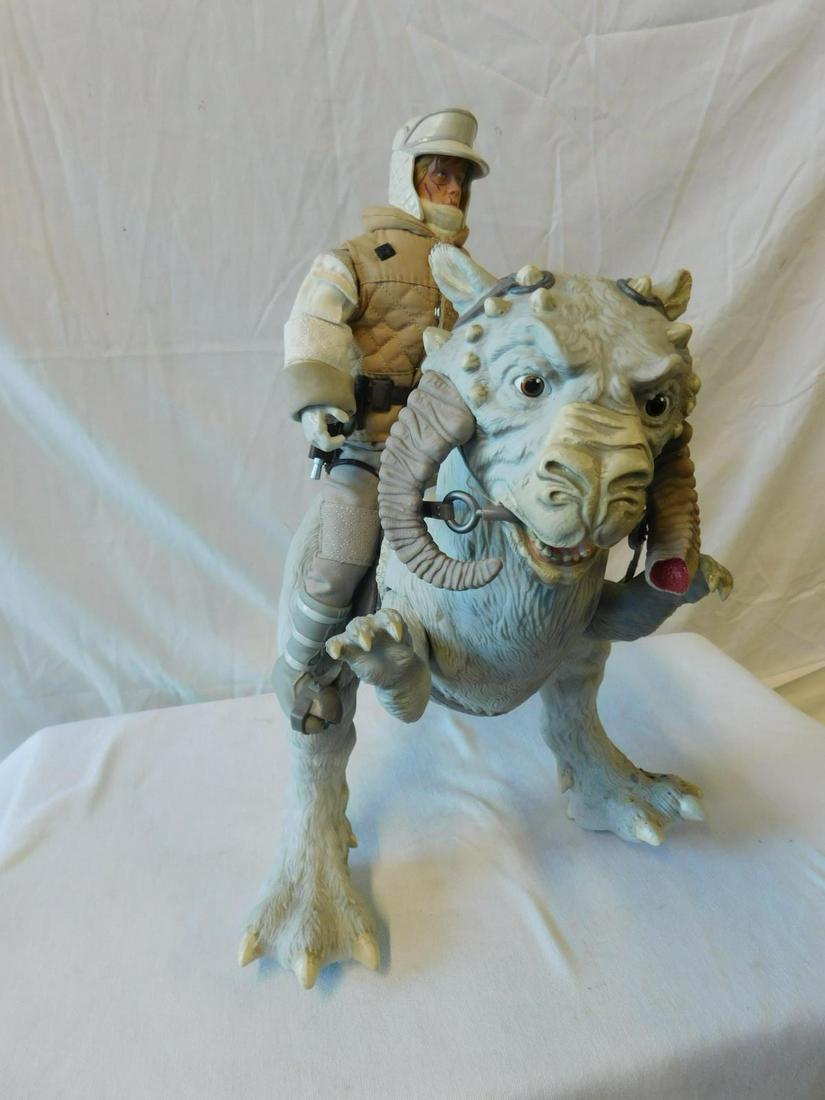Hasbro Star Wars "Luke" Action Figure: Hasbro Star Wars "Luke" Action Figure, Luke Skywalker on Tauntaun, 12" poseable figure in full Hoth snow gear with jointed moveable 15" Tauntaun, #C-Ozze. CONDITION: Break in plastic rein strap, other