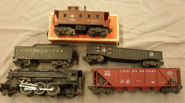 Pre & Post War Lionel Trains: Pre & post war Lionel O gauge trains, #224 Steam 2-6-2 engine, #2224 Plastic Tender, #6436-25 Lehigh Valley Quad Hopper, #6457 Lionel SP-type Caboose w/box, & #6462 NYC Gondola.