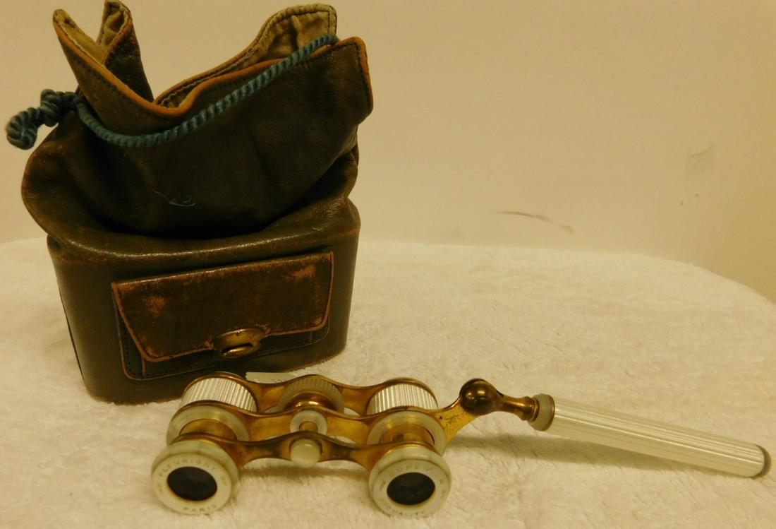 Vintage French Enameled Opera Glasses: Vintage French Enameled Opera Glasses by Fleurigny, Paris, white iridescent feather ribbed enameling with mother of pearl fittings, folding extension handle, length with folded handle 4 1/2", mid 20th