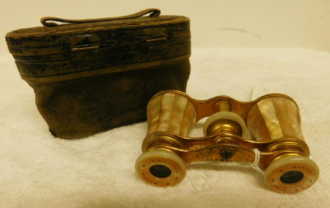 French Mother of Pearl Opera Glasses: French Mother of Pearl opera glasses by Le Maire, Paris,, Mother of Pearl panels and lens covers. Dore' brass, early 20th c., 3 3/4" l., including original leather case. (# 57) Condition; very good, l