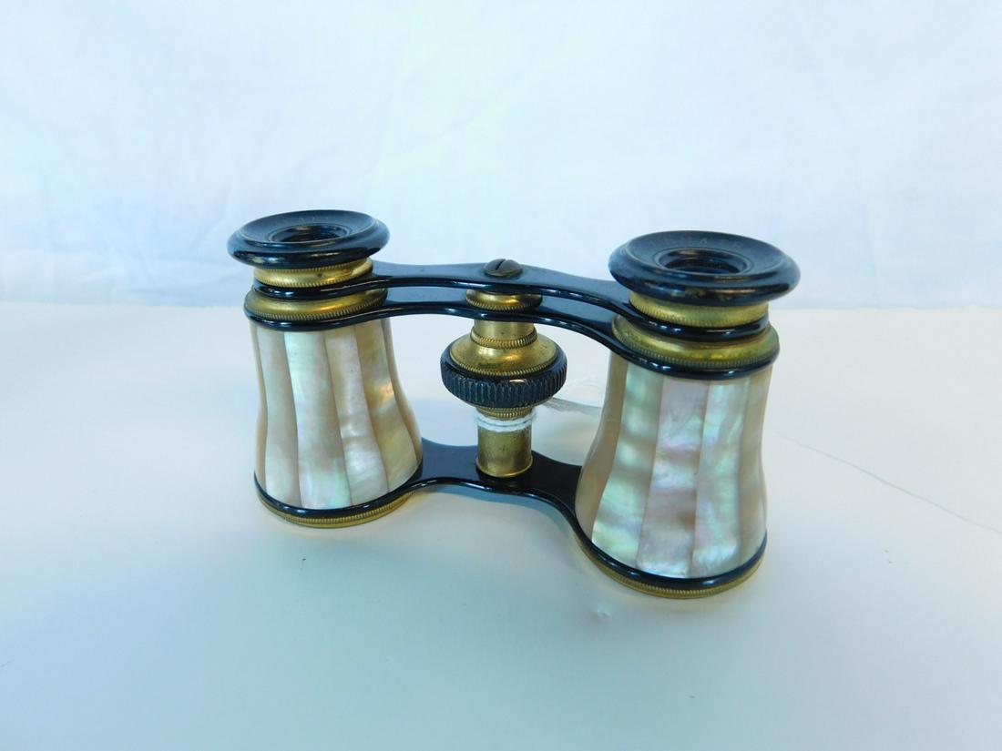 Vintage Mother of Pearl Opera Glasses: Vintage Mother of Pearl Opera Glasses by Geary & Weale, Baltimore; Dore brass with black enameling, early 20th C, 3 3/4"l, with original leather case. [2] CONDITION: Very good, lightly used, small are