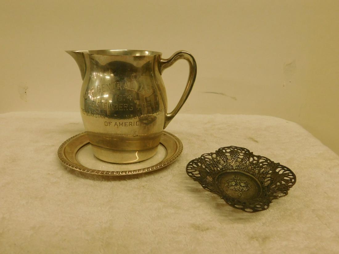 3 Silver Table Pieces: Three Silver Table Pieces includes: Poole sterling Paul Revere Repro pitcher inscribed, New General agent 1974 etc, 4 1/2"h (9.1 ozts); sterling and glass 5 1/2" tray; and an 800 silver (tested) embos