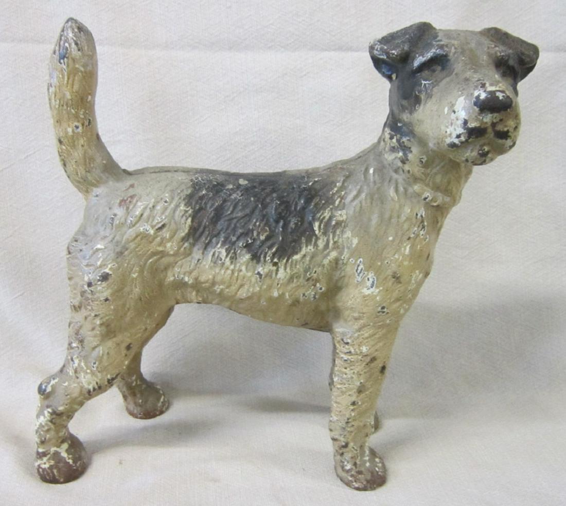 Vintage Cast Iron Door Stop: Vintage Cast Iron Door Stop, terrier, hand painted, unmarked, 7 1/2" l x 8 1/2"h. CONDITION: Some paint loss from age and use.