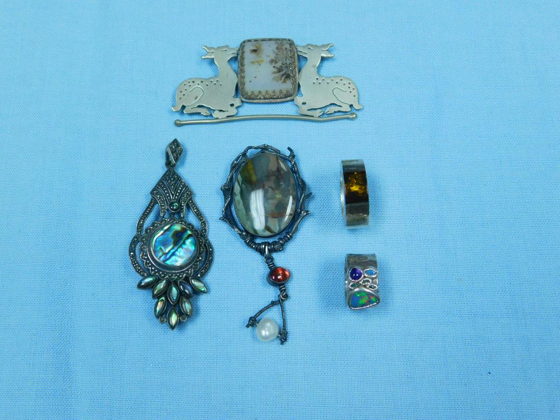 Sterling Artisan Jewelry Group: Sterling Artisan Jewelry Group includes: Abalone and marcasite pin pendant, 2 3/4"; Urania signed square Moss agate flanked by deer pin, 2 7/8"; illegibly signed cabochon oval agate with pendant oval