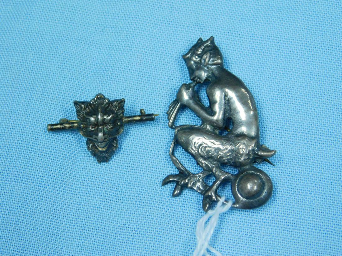 Sterling Pan Figure, Gargoyle Pin: Sterling Pan Figure, Gargoyle Pin, mythical Pan with his pipes 2" x 1". Small unmarked gargoyle mask pin 1 1/8" across. Pan -5.7 DWT, Gargoyle 1.9 DWT. [4] CONDITION: Vintage, good.