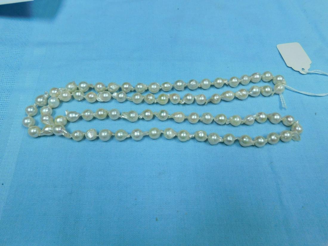 Fresh Water Pearl Necklace: Fresh Water Pearl Necklace, 33" length, individually knotted Baroque form white lustre approx. 8mm diam. pearls. CONDITION: Very fine.