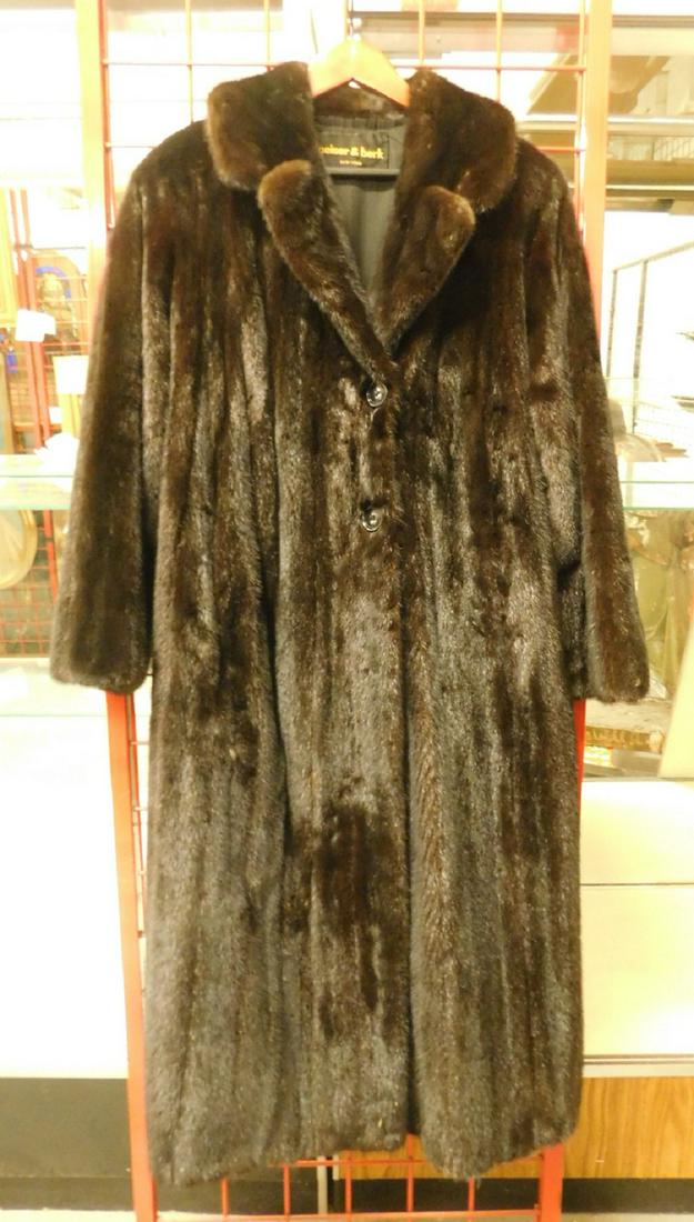 Full Length Ranch Mink Coat: Full Length Ranch Mink Coat, from Peiser & Berk, New York, features notched collar and button front, black liner, concealed side pockets, 50"l, shoulder to shoulder 18", arm length from shoulder 23".