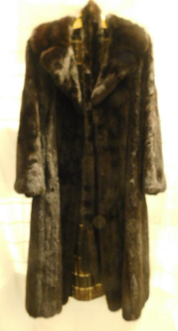 Full Length Ranch Mink Coat: Full Length Ranch Mink Coat, from Shulman Furs, Phila., notched collar, silk liner with owners name, approx. 45"l, shoulder to shoulder 17", sleeve length from shoulder 22". CONDITION: Very good.