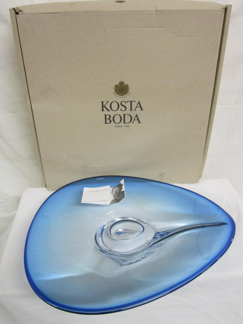Kosta Boda Charger: Kosta Boda Charger, in sapphire to clear glass, designed by Goran Warff, with original box and inside wrapping paper, approx. 17" and store stock, new in box. CONDITION: New in box.