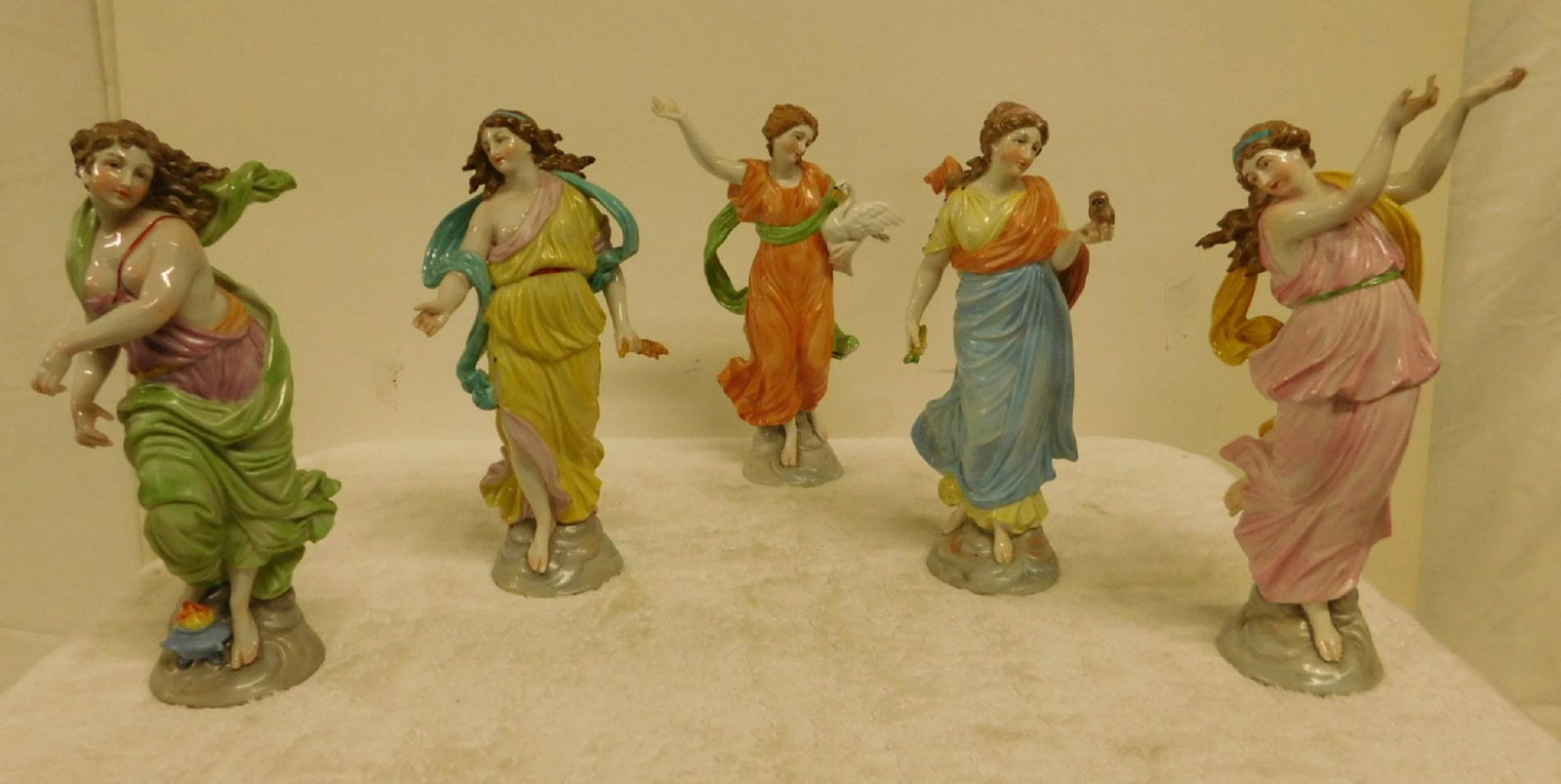 5 Antique Capo di Monte Figures: Five Antique Capo di Monte Figures, highly detailed and colorfully glazed porcelain, Classical maidens in various gowns, approx. 8"h, 19th / 20th C. CONDITION: Very fine, one with two professionally r