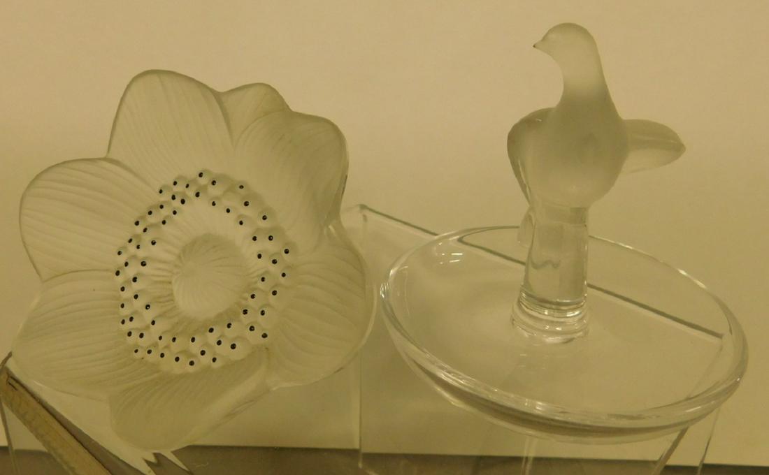 2 Lalique Crystal Pieces: Two Lalique Crystal Pieces, includes: "Tourterelle" turtle dove ashtray, No. 10716, and "Anemone" flower. CONDITION: Very fine, no issues identified.