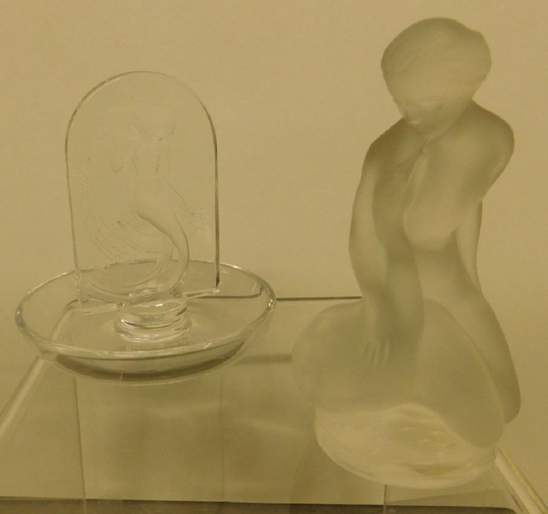 2 Lalique Crystal Pieces: Two Lalique Crystal Pieces, includes: Leda with swan No. 11905, 4 1/2"h and "Naiade" ashtray, No. 10704, 4 1/4"h. CONDITION: Very fine, no issues identified.