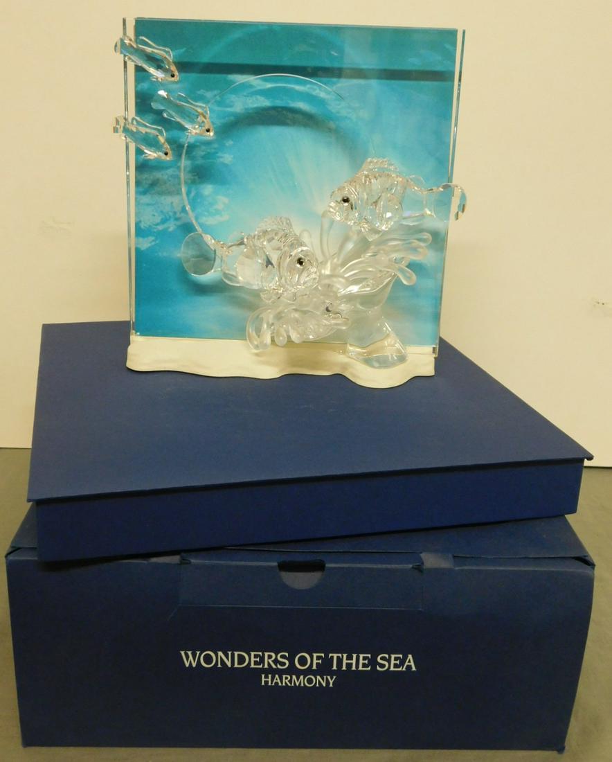 Swarovski "Wonders of The Sea": Swarovski "Wonders of The Sea","Harmony", clear crystal fish on panel with mirror or paper interchangeable background, approx. 7 1/2" x 8 1/4", original fitted boxes. CONDITION: Like new.