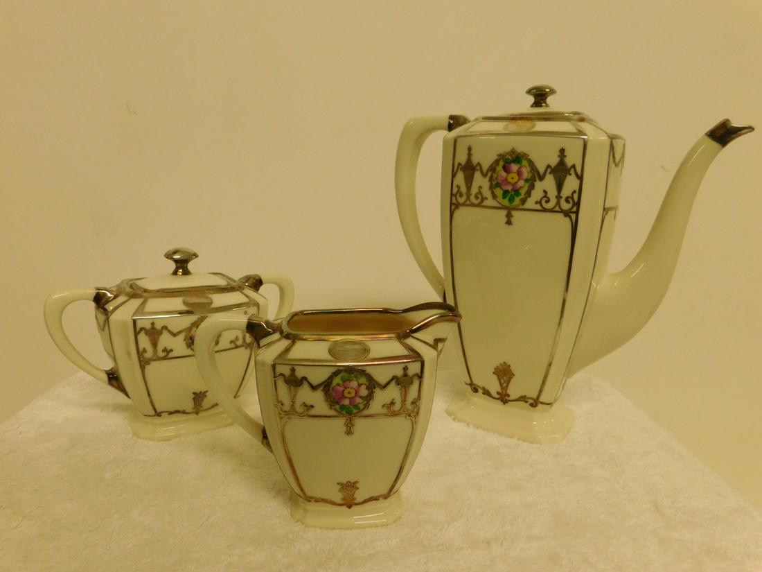 Vintage Lenox Belleek, 3 Pc Coffee Set: Vintage Lenox Belleek, three Piece Coffee Set, green mark, features sterling silver overlay and floral painted medallions, include: coffee pot, sugar and creamer, early 20th C. CONDITION: Very fine.